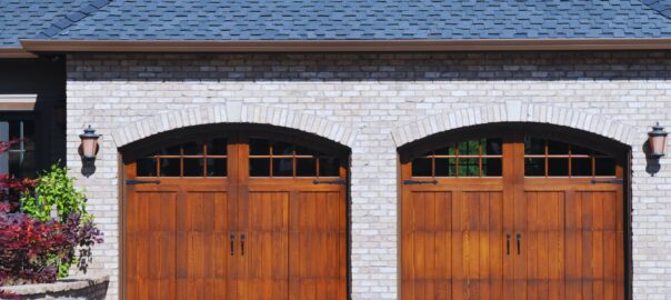 A wooden garage door of a residential property with space for two cars, showcasing the aesthetic appeal and functionality of Garage Door In My Area's installations.